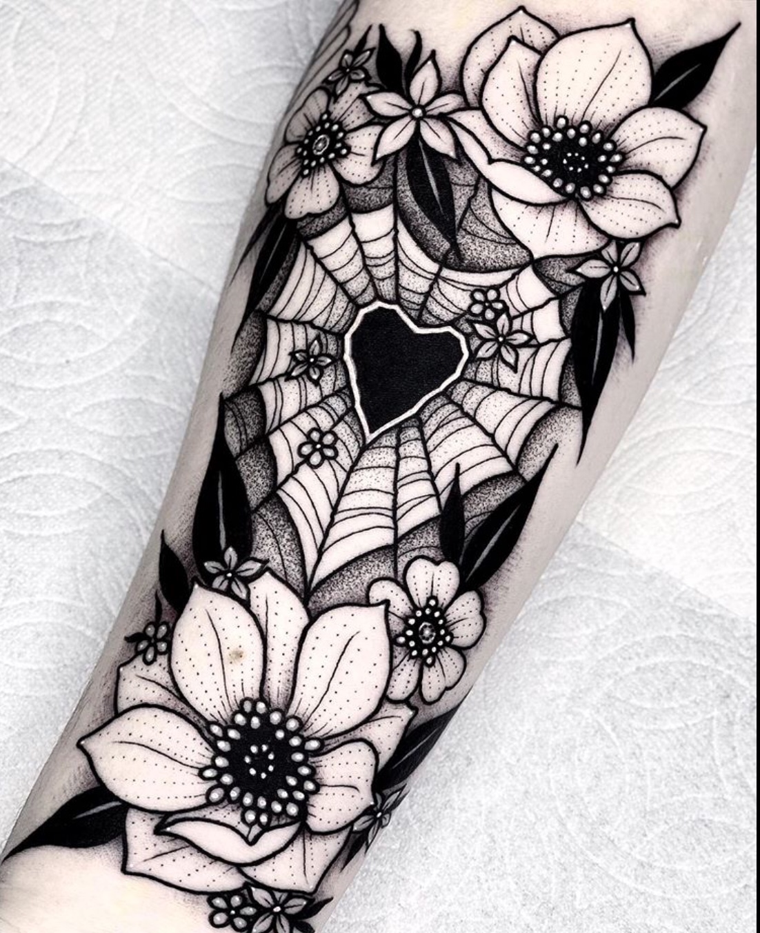 heart tattoo with flowers