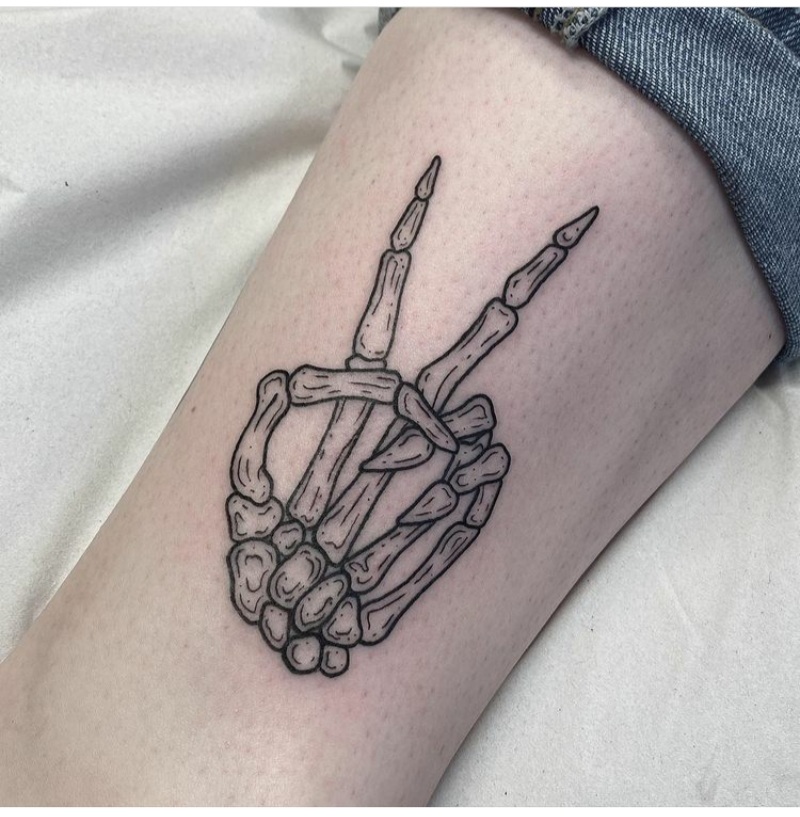 skeleton hands tattoos