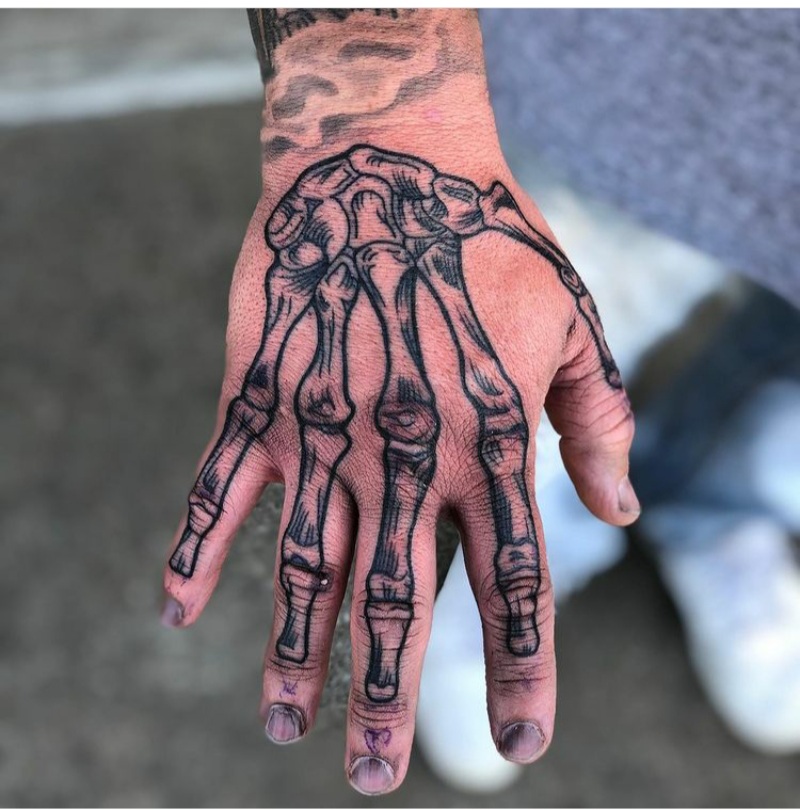 skeleton hands tattoos