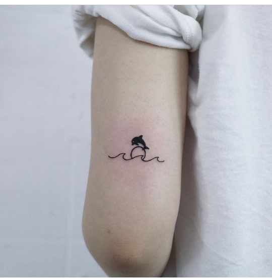 Tattoo uploaded by sourya • * Delphinidae * #finelinetattoo #singleneedle  #realistictattoo #smalltattoo #inked #ink #blackandgrey #tattoo #tattooist # dolphin #dolphintattoo • Tattoodo