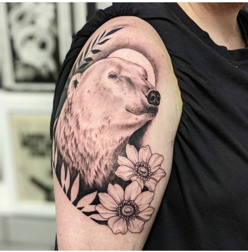 Single needle polar bear tattoo on the bicep