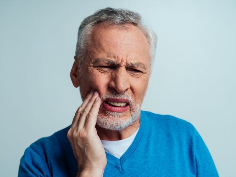 man with dental discomfort